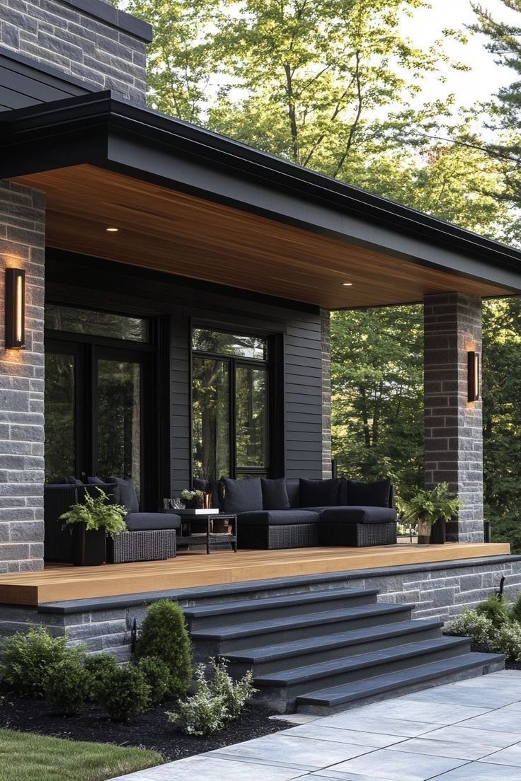 Over ons –Moderne veranda met donkere aluminium kozijnen en grote glaspartijen